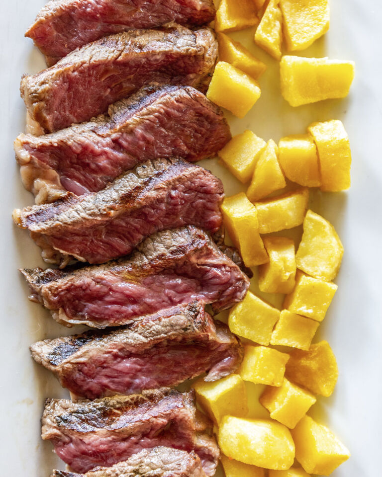 Angus skirt steak grilled over embers at Con Acento Parrilla